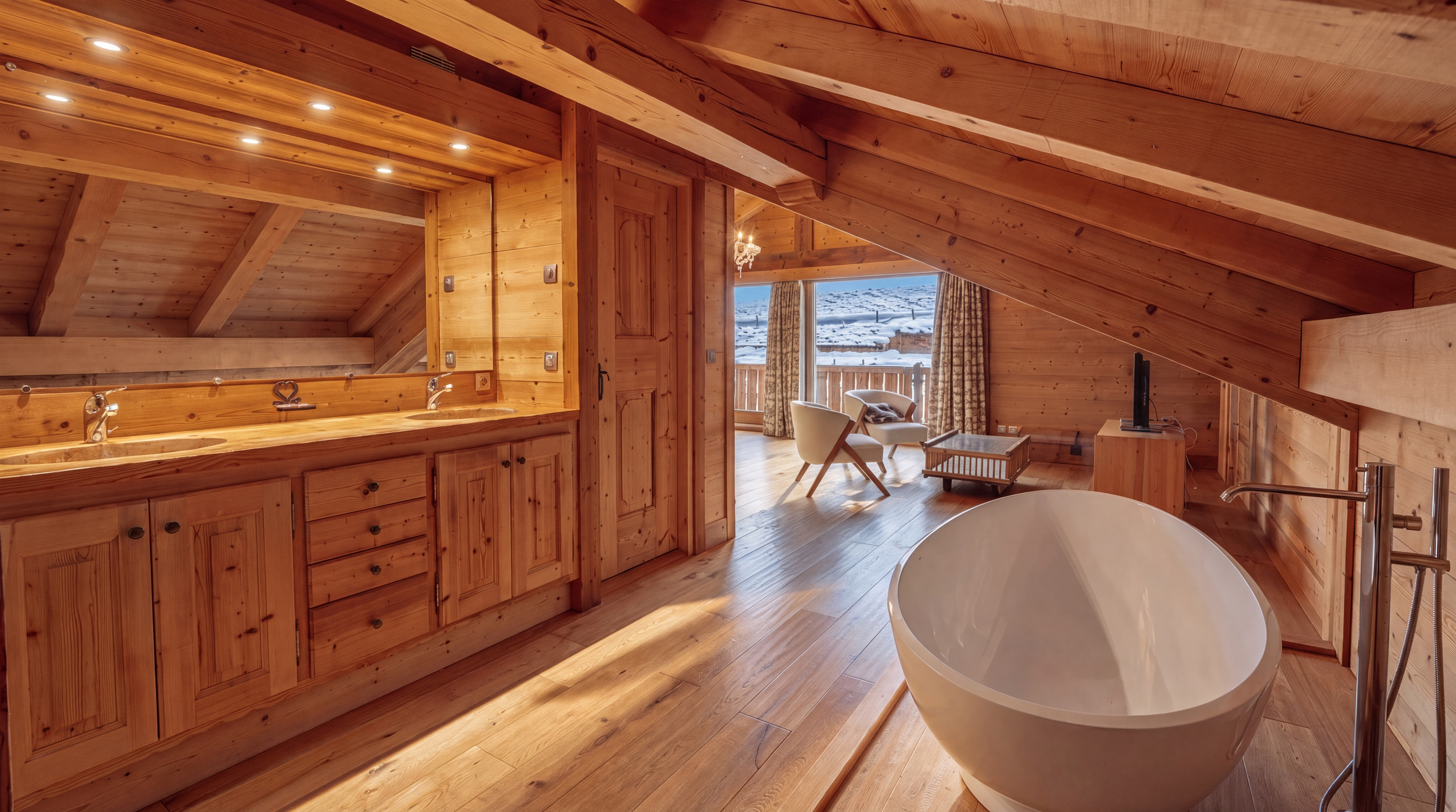 Double vanity and freestanding bathtub in the principal suite